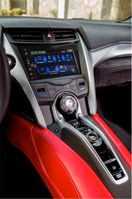Drive modes are chosen with that gigantic knob in the middle. Photo credit: Acura